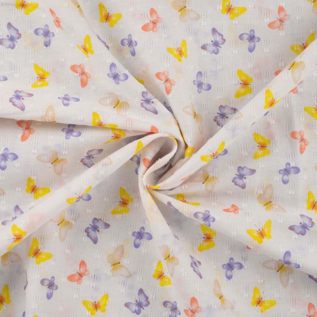 Tissu Voile Plumetis de Coton Papillons jaunes et lilas sur fond Blanc cassé