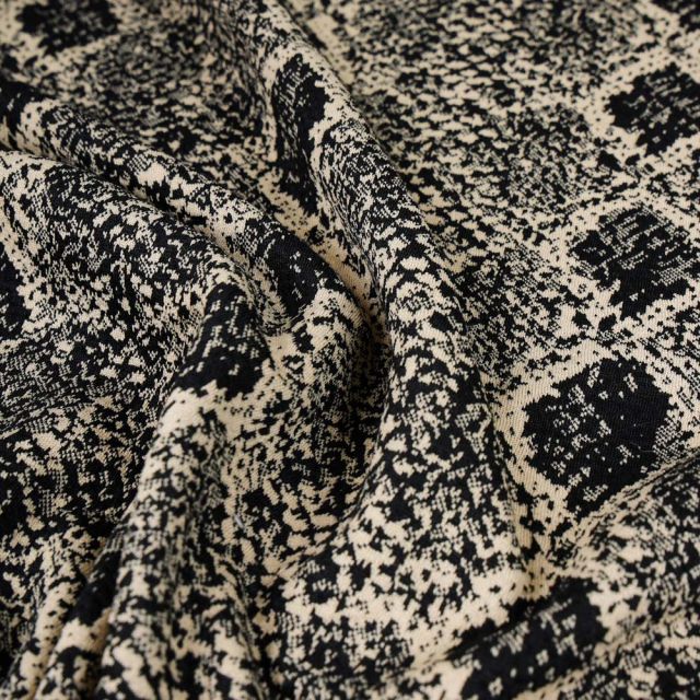 Tissu Maille Jacquard Reptiles beige sur fond Noir