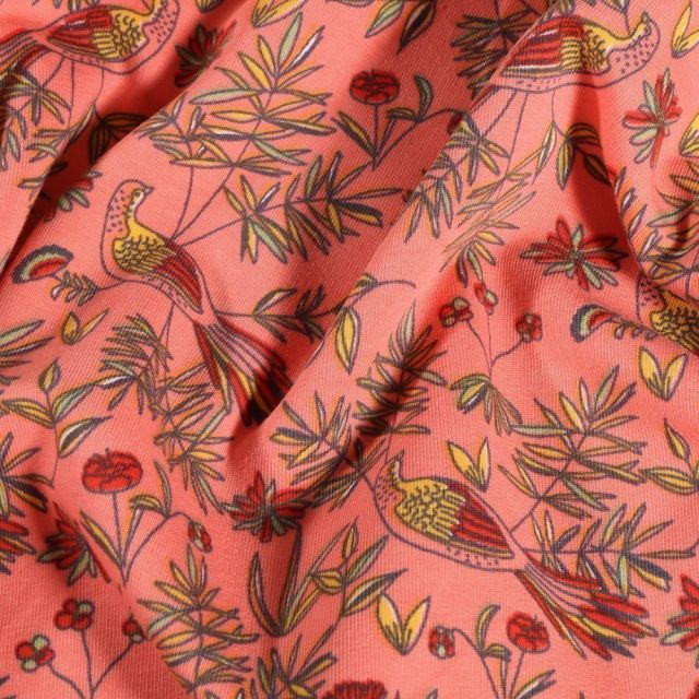 Tissu Jersey Coton Oiseaux et feuillages sur fond Corail - Par 10 cm